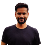 Head and Shoulder Photograph of Nishith Shah, Nishith is smiling and casually dressed in a black t shirt